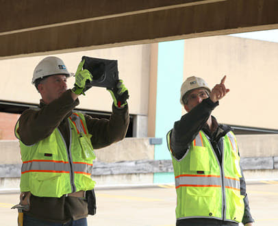 Two engineers discussing structural health